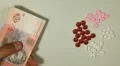Ukrainian Hryvna UAH, Counting Drugs and Money, Health Care, Colorful Pills HD Footage