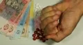 Ukrainian Hryvna UAH, Counting Drugs and Money, Health Care, Colorful Pills HD Footage