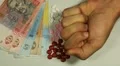 Ukrainian Hryvna UAH, Counting Drugs and Money, Health Care, Colorful Pills HD Footage