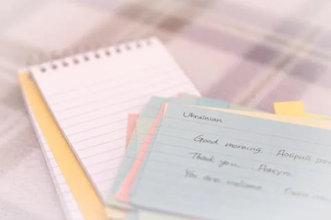 Ukrainian; Learning New Language Writing Greetings on the Notebook Stock Photos