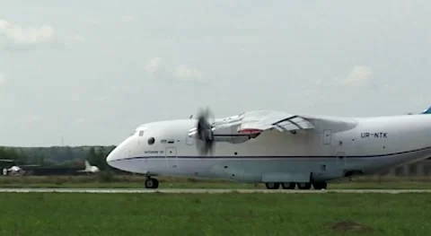 Ukrainian medium-sized cargo aircraft with four engines An-70 taxis on runway. Stock Footage 172192208