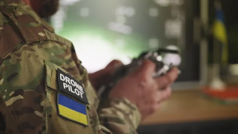 Ukrainian military drone pilot practicing UAV flight during wartime training Stock Footage 335539087