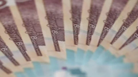 Ukrainian national currency circle stack turns fast in bright light closeup Video stock 324758689