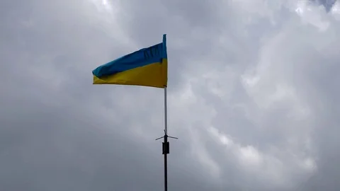 Ukrainian national flag on the clouds background Stock Footage 76450322