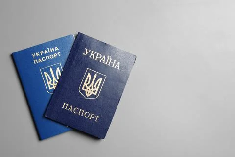 Ukrainian passports on grey background, top view with space for text. Interna Stock Photos
