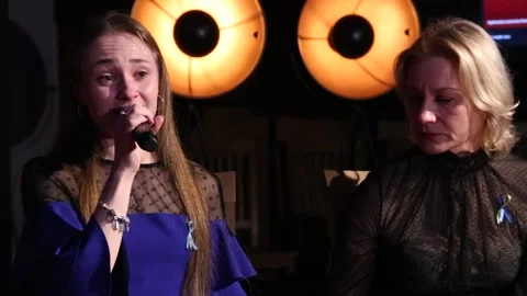 Ukrainian singer Sofija Popova (L) getting emotional during press conference Stock Footage 171473526