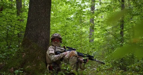 Sniper reload his rifle in forest Stock Photo by ©Nesterenko_Max 89103288