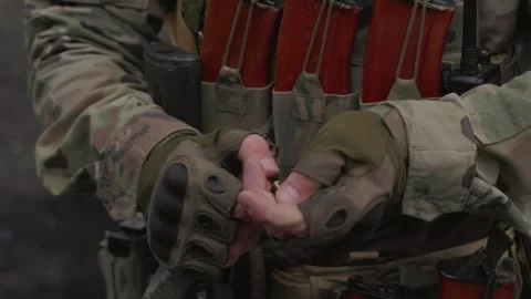 Ukrainian soldier loading his weapon Stock Footage 246414883