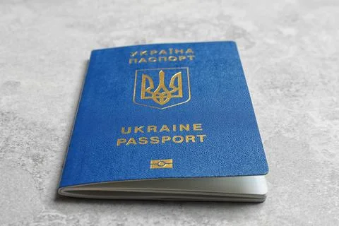 Ukrainian travel passport on grey background, closeup. International relation Stock Photos