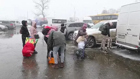 Ukrainians queue at Ukraine-Romania border crossing point, CHERNIVTSI, RO - 10 M Stock Footage 204109384