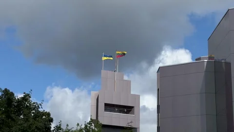 Ukranian and Lithuanian flags waving on the wind on building top in Vilnius Stock Footage 246973034