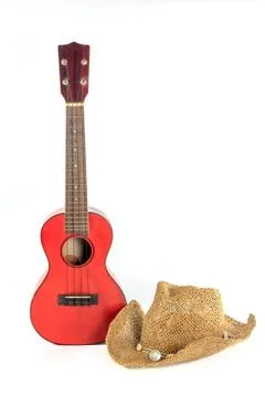 Ukulele and straw hat isolate 스톡 사진