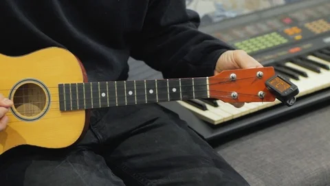 Ukulele guitar close up Stock Footage 103807775