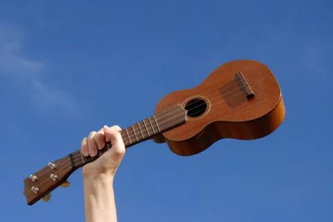 Ukulele in hand Stock Photos