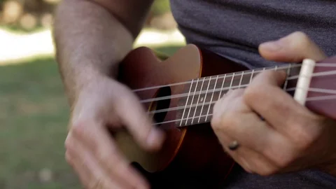 Ukulele strumming chords close up Stock Footage 107862385