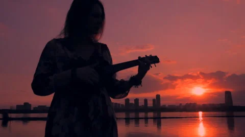 Ukulele at sunset Stock Footage 63509815