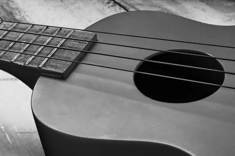Ukulele on wooden table Stock Photos