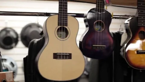 Ukuleles and guitars pan Stock Footage 69111379