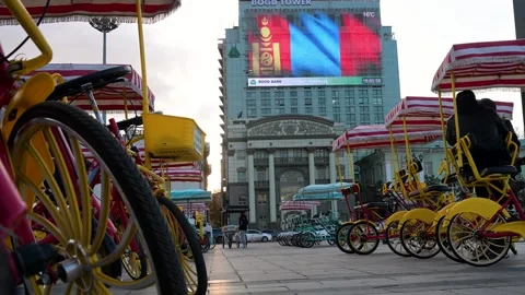 Ulaanbaatar Mongolia: Rental Carts Parked at Sukhbaatar Square - Digital Flag Stock Footage 328401948