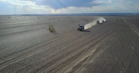 Ulan-bator / mongolia, July 13, 2019: cars driving in the desert from above Stock Footage 122137218