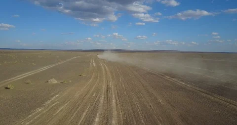 Ulan-bator / mongolia, July 13, 2019: cars driving in the desert from above Stock Footage 122137229