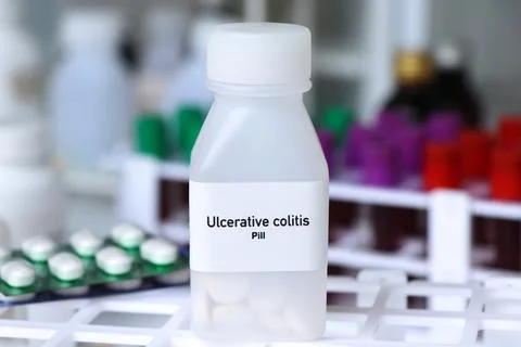 Ulcerative colitis pill in white bottle, pill stock Stock Photos