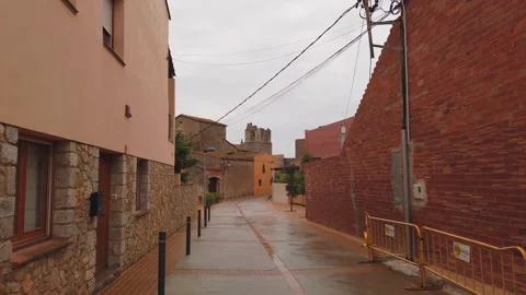 ULLÀ, SPAIN – 2025/04/12: Empty village street during rainy afternoon Stock Footage 331153320