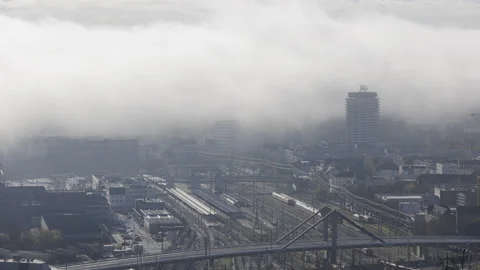 Ulm main station and bridge with low clouds at morning in autumn time lapse Stock Footage 221824719