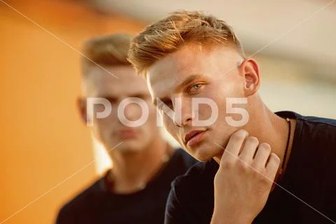 For ultimate comfort. Athletic men outdoor. Pair of twins with muscular look Stock Photos