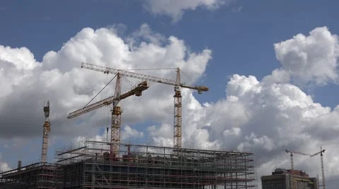 ULTRA HD 4K Crane machine work top skyscraper town blue sky sunny summer day Stock Footage 41458967