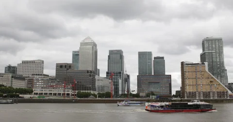 Ultra HD 4K Facade Canary Wharf Skyline Thames River London Tour Boat Passing Stock Footage