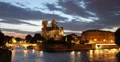 Ultra HD 4K Illuminated Dusk Night Light Famous Notre Dame Boat passing Paris 4k or 4k+ Resolution