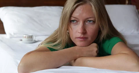 Ultra HD 4K Lonely abandoned sorrowful depressed woman girl laying bed Stock Footage 32254792