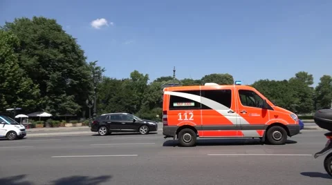 ULTRA HD 4K Pan right follow ambulance car safety mission Berlin city traffic  Video stock 49661981