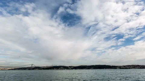 Ultra HD 4K, Time Lapse clouds moving across the blue sky with Bosphorus Bridge Stock Footage 47563622