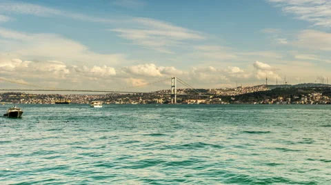 Ultra HD 4K, Time Lapse clouds moving across the blue sky with Bosphorus Bridge Video stock 47575176