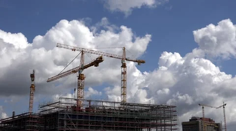 ULTRA HD 4K Timelapse crane work construction site urban town blue sky cloud day Stock Footage