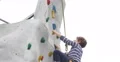 Ultra HD 4K Upward Young Boy Climbing Up Wall Rock Active Hobby Kids Adventures 4k or 4k+ Resolution