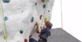 Ultra HD 4K Young Boy Climb Up Artificial Rock Wall Kids Playground Outdoor Park 4k or 4k+ Resolution
