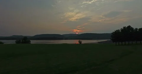 Ultra HD - The Sun Sets Behind the Mountains and Lake Stock-Footage 52135700