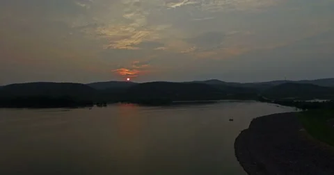 Ultra HD - The Sun Sets Behind the Mountains and Lake Stock Footage 52136828