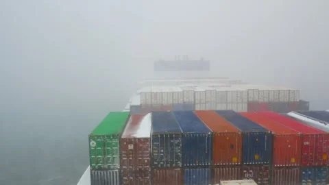 Ultra large container ship passing through the snow storm in Pacific ocean Stock Footage 244385061