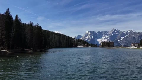Ultra Low Proximity Water Flight Forward Revealing Alpine Grand Palace H Video stock 340601946