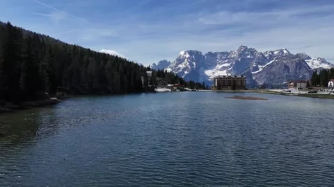 Ultra Low Water Surface Push Shot Revealing Historic Waterfront Settlem Stock Footage 340758284