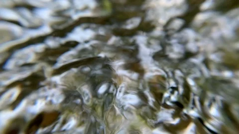 Ultra Macro Closeup shot of a river or steam waters flowing around pebbles 스톡 동영상 122536149