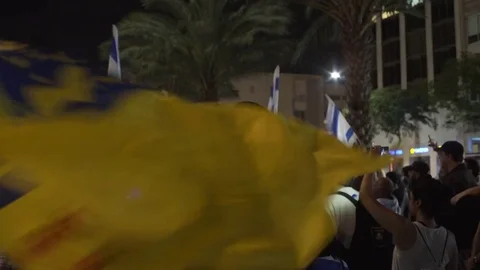 Ultra right wing settlers protest, man waves Messiah flags, Tel Aviv, Israel Stock Footage 70727163