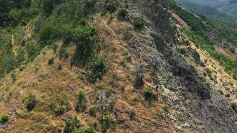 Ultra runners climbing down a mountain 5 drone Stock Footage 317238259