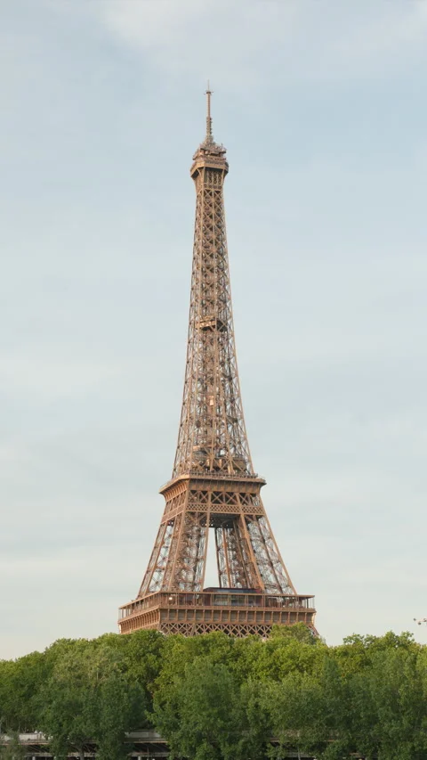 Ultra Sharp 4K Cinematic Portrait Shot of the Iconic Eiffel Tower Rising Above a Stock Footage 338326764