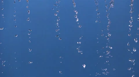 Ultra-slow motion beads of water sliding down blue frame Stock Footage 59527240