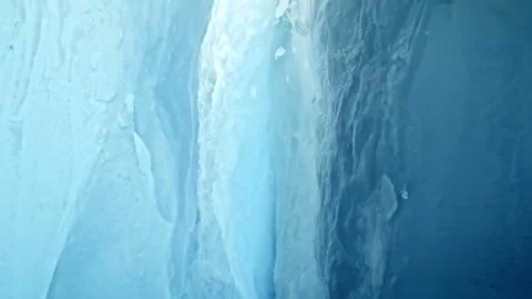 Ultra Slow Motion Camera Passing Through Glacier Ice Crack With Falling Ice. Stock Footage 330939878